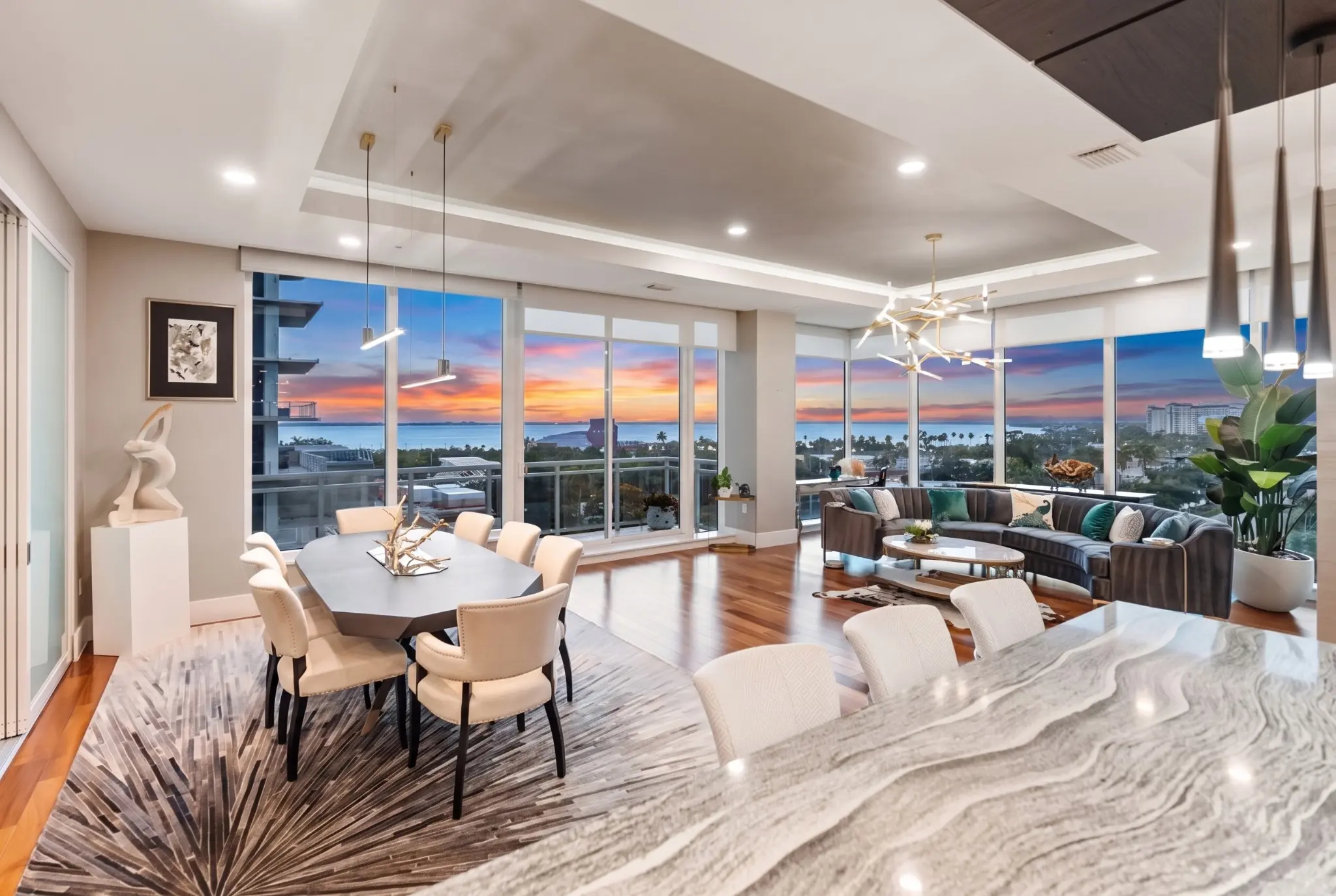 Residence 702 great room at sunset with views across Sarasota